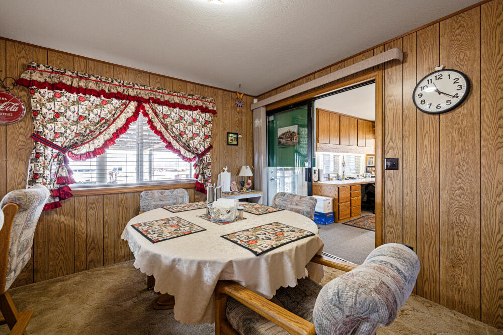 891 Cross Road Klamath Falls, OR 97603 - Photo 38 of 66 a view of a dining room with furniture window and outside view
