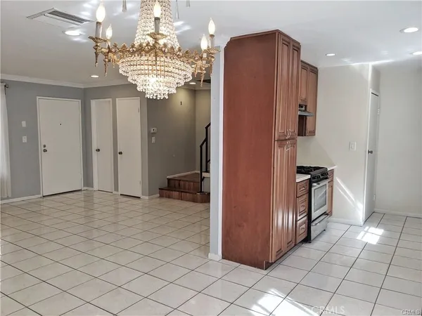 a kitchen with stainless steel appliances granite countertop a refrigerator and cabinets