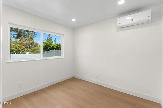 a view of a room that has a window in it