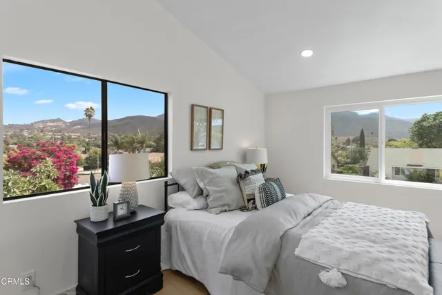 a bedroom with a bed and window