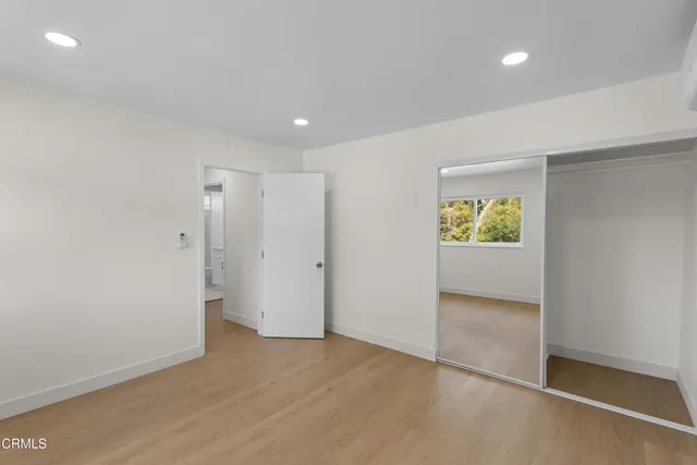 an empty room with a bathroom