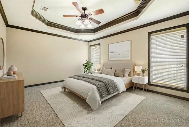a spacious bedroom with a bed and a chandelier