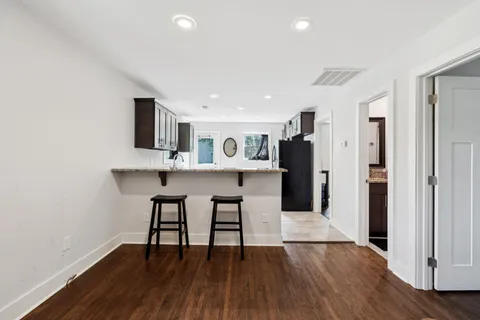 a kitchen with stainless steel appliances granite countertop a refrigerator and a sink