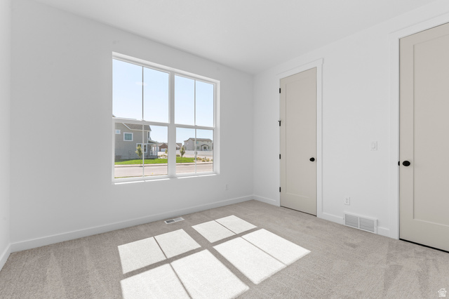 3016 West 2650 North Clinton, UT 84015 - Photo 9 of 20 Unfurnished bedroom with light colored carpet and baseboards