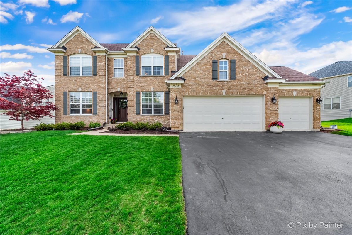 3503 High Ridge Road Carpentersville, IL 60110 - Photo 1 of 29 a front view of a house with a yard and garage
