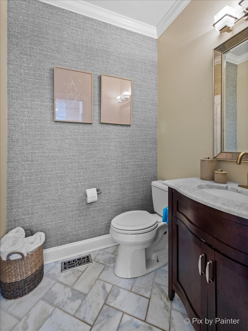 3503 High Ridge Road Carpentersville, IL 60110 - Photo 15 of 29 a bathroom with a granite countertop toilet and a sink