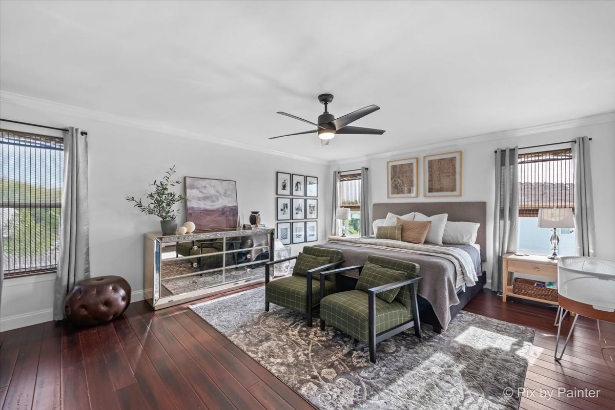 3503 High Ridge Road Carpentersville, IL 60110 - Photo 17 of 29 a spacious bedroom with a bed and a wooden floor