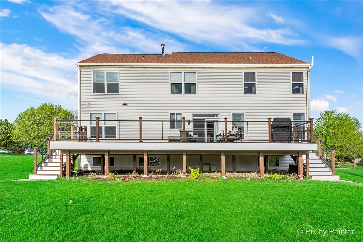 3503 High Ridge Road Carpentersville, IL 60110 - Photo 27 of 29 a view of a big house with a big yard and large trees