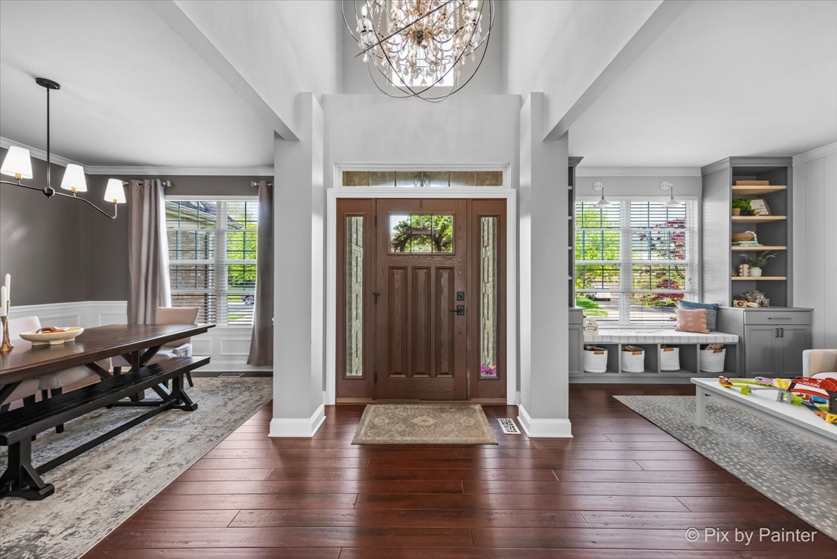 3503 High Ridge Road Carpentersville, IL 60110 - Photo 3 of 29 a view of an entryway with wooden floor and windows