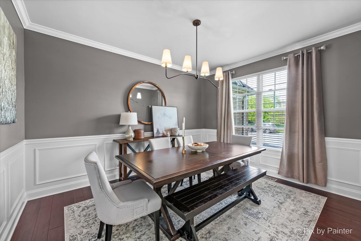 3503 High Ridge Road Carpentersville, IL 60110 - Photo 5 of 29 a dining room with furniture a chandelier and wooden floor