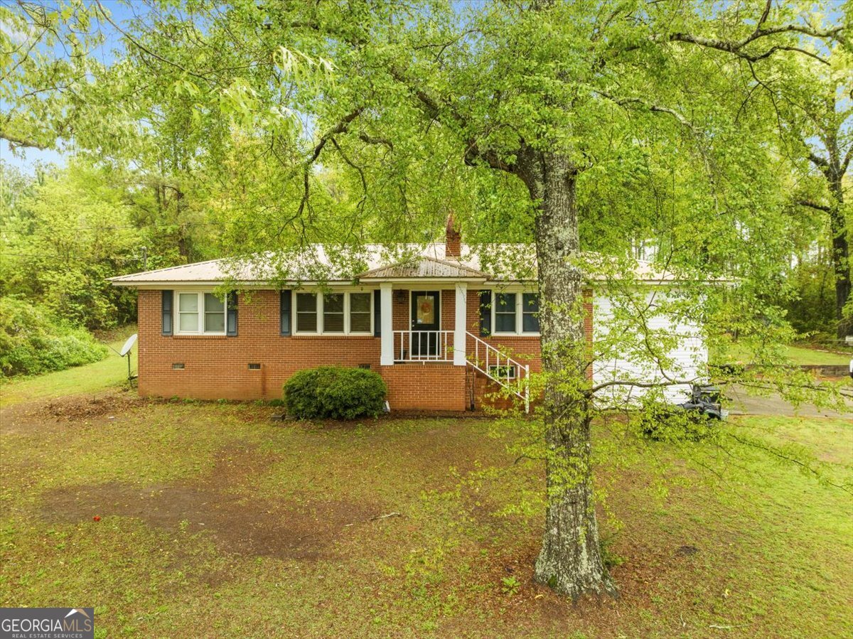2453 Highway 441 Dublin, GA 31021 - Photo 1 of 1 a view of a house with pool and sitting area