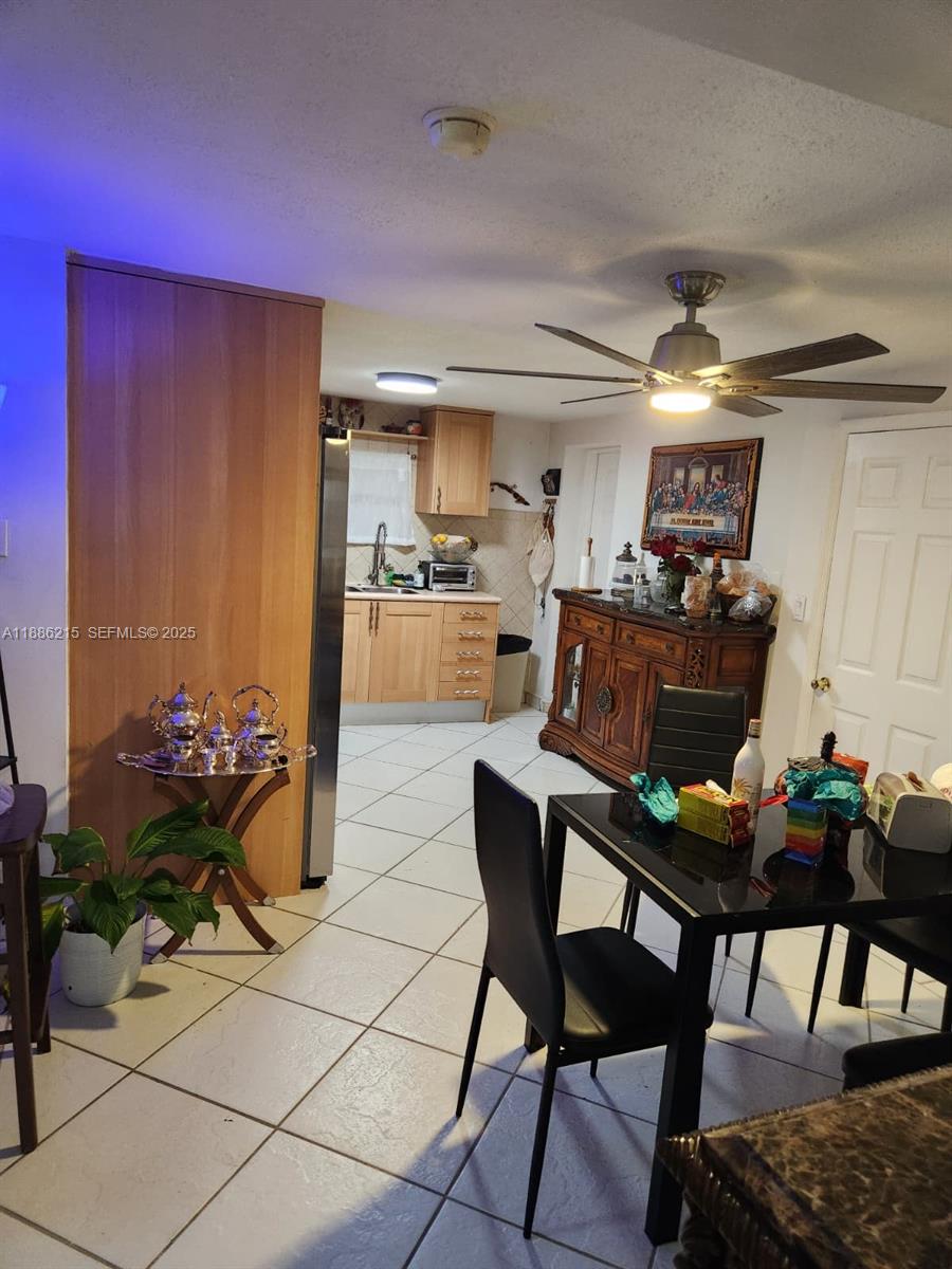 614 East 56th Street Hialeah, FL 33013 - Photo 11 of 78 a living room with furniture and wooden floor