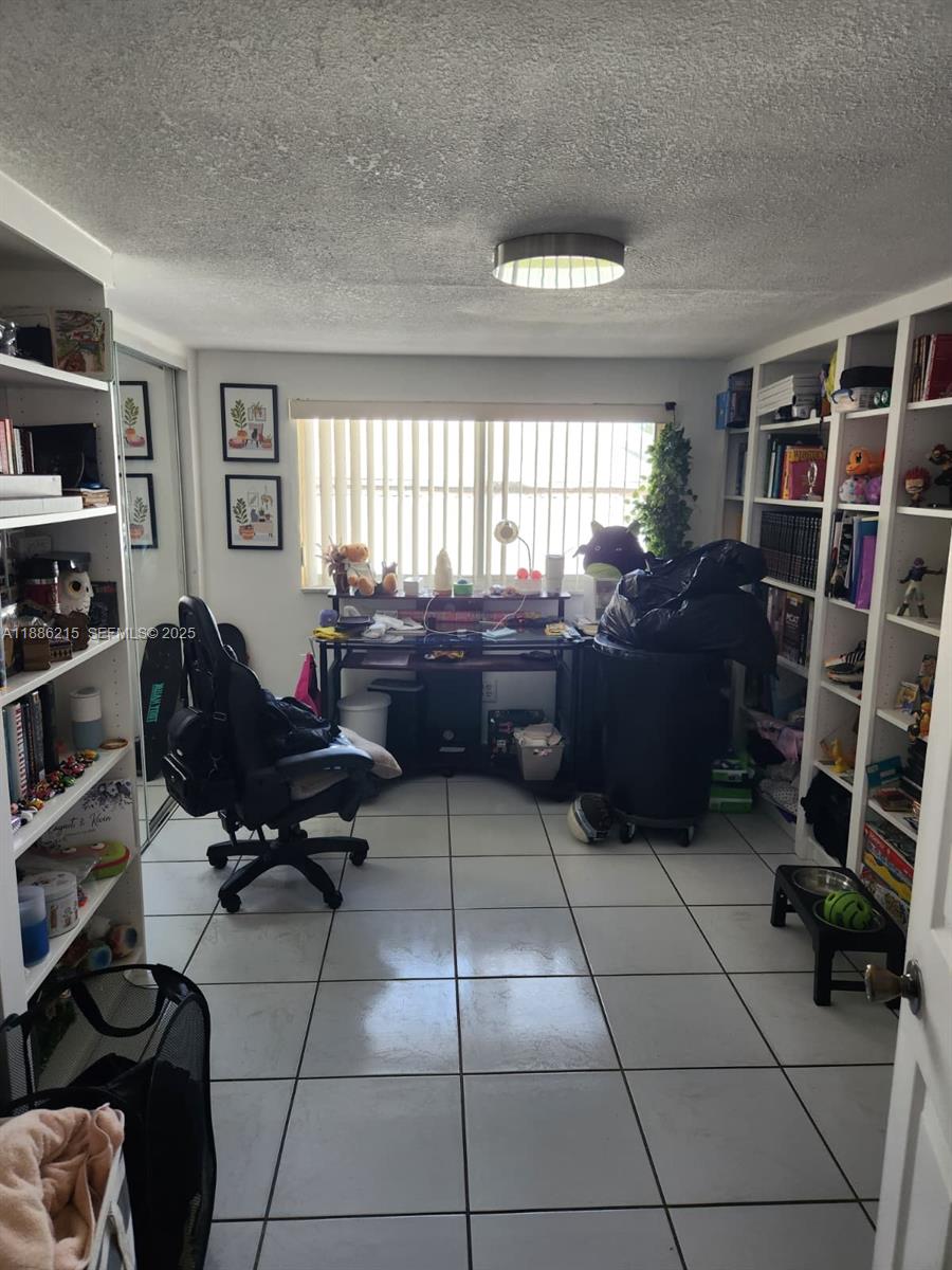614 East 56th Street Hialeah, FL 33013 - Photo 15 of 78 a living room with furniture and a window