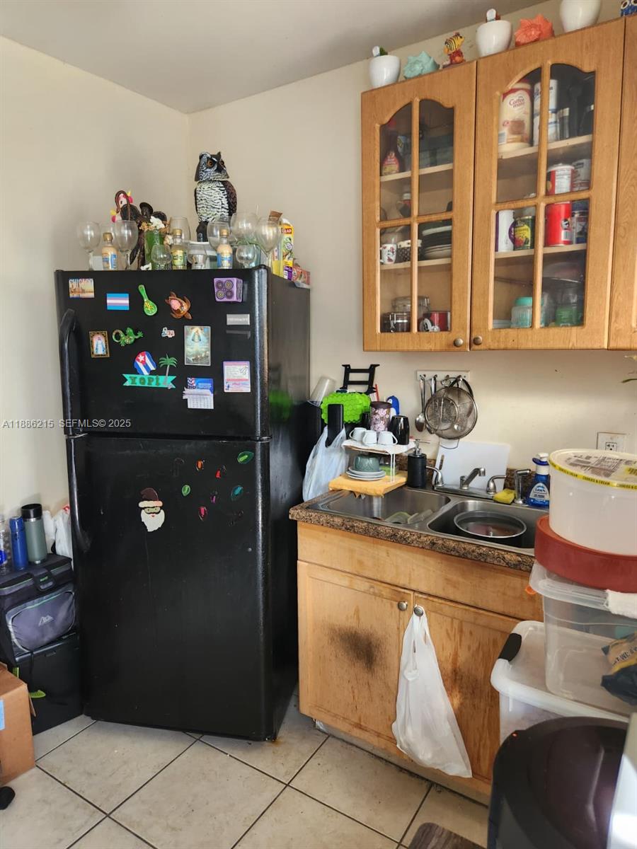 614 East 56th Street Hialeah, FL 33013 - Photo 21 of 78 a kitchen with stainless steel appliances granite countertop a refrigerator and a stove