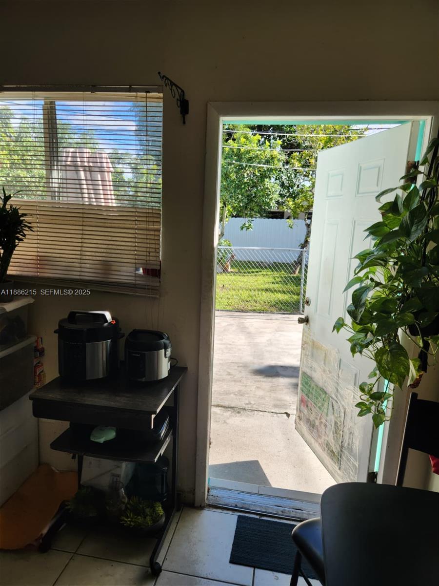 614 East 56th Street Hialeah, FL 33013 - Photo 28 of 78 a living room with furniture and a potted plant