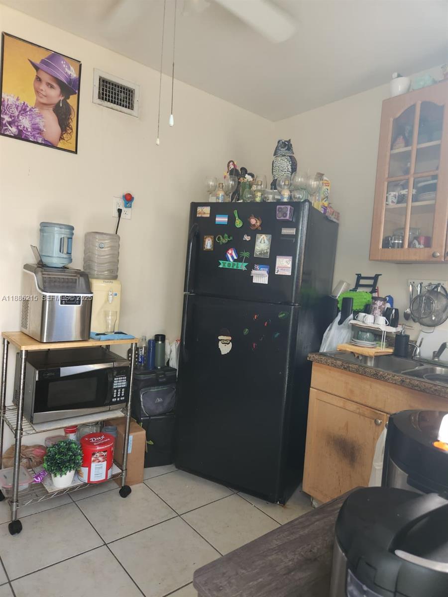 614 East 56th Street Hialeah, FL 33013 - Photo 32 of 78 a room with furniture and wooden floor