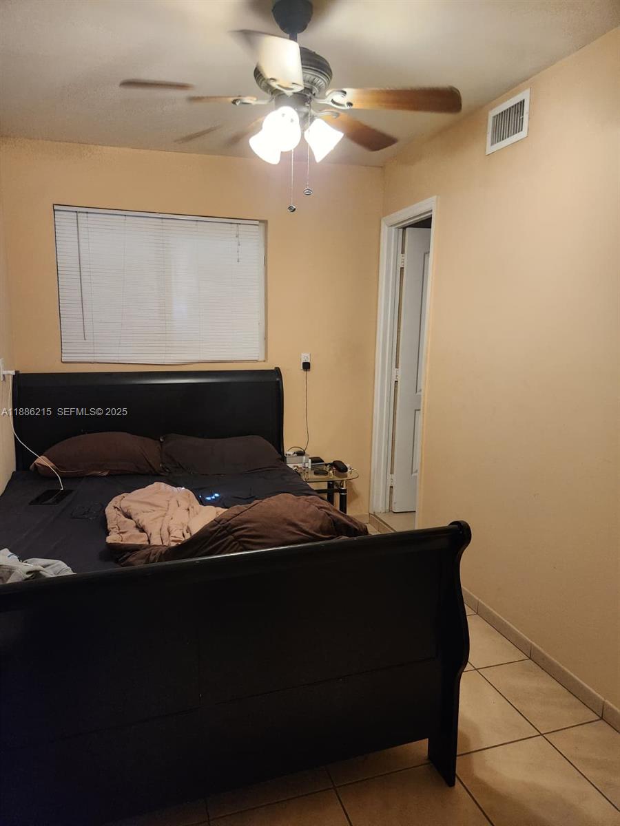 614 East 56th Street Hialeah, FL 33013 - Photo 38 of 78 a living room with furniture and a window