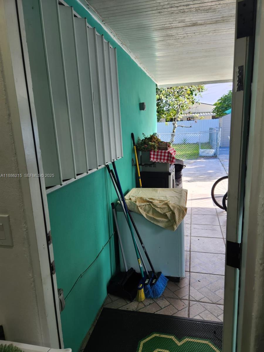 614 East 56th Street Hialeah, FL 33013 - Photo 45 of 78 a view of a balcony with chair and table