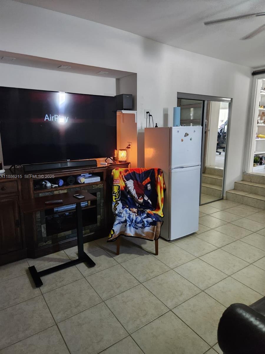 614 East 56th Street Hialeah, FL 33013 - Photo 54 of 78 a room with furniture and a flat screen tv