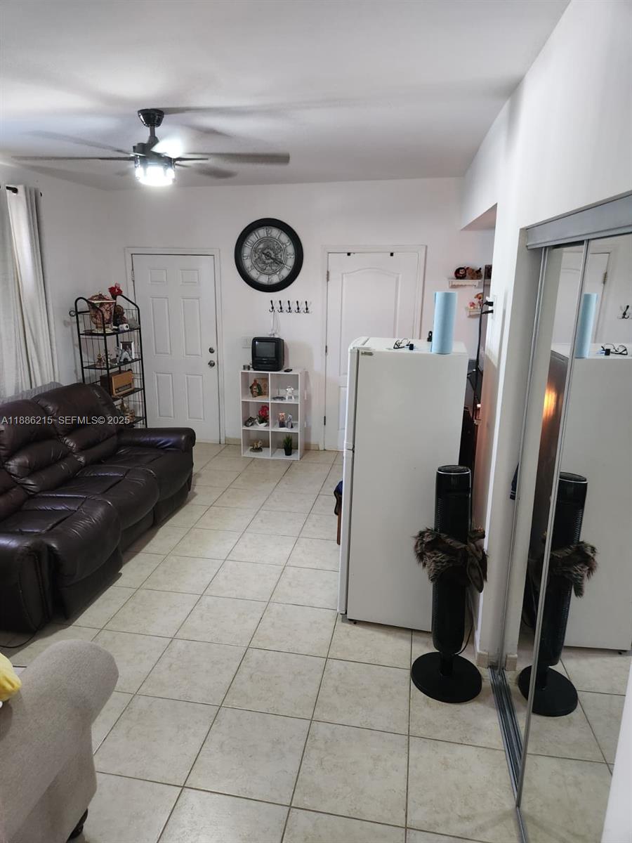 614 East 56th Street Hialeah, FL 33013 - Photo 57 of 78 a kitchen with a refrigerator and a stove top oven