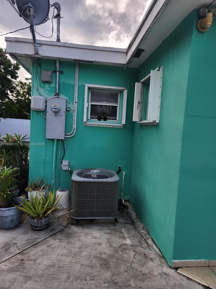 614 East 56th Street Hialeah, FL 33013 - Photo 62 of 78 a room with furniture and a potted plant