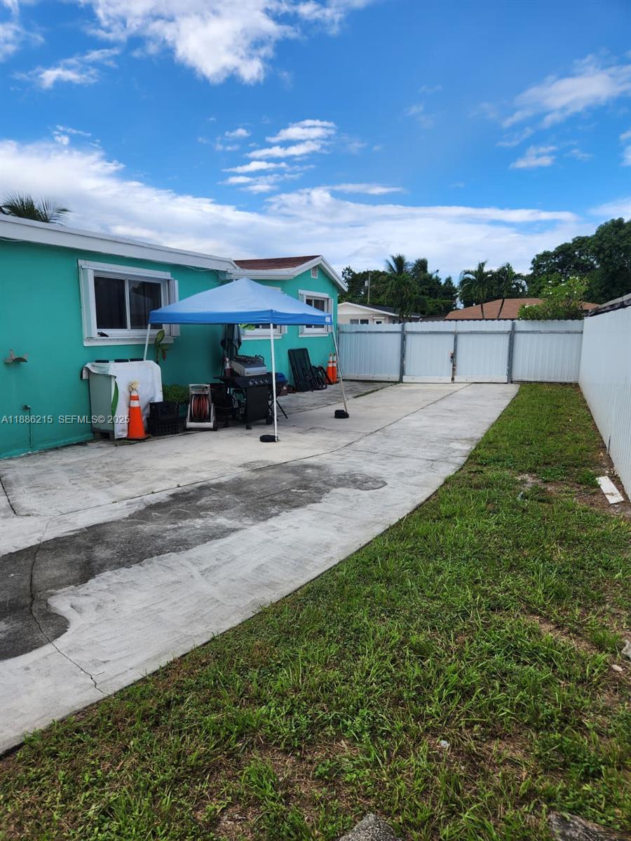 614 East 56th Street Hialeah, FL 33013 - Photo 69 of 78 a view of a house with backyard porch and outdoor space
