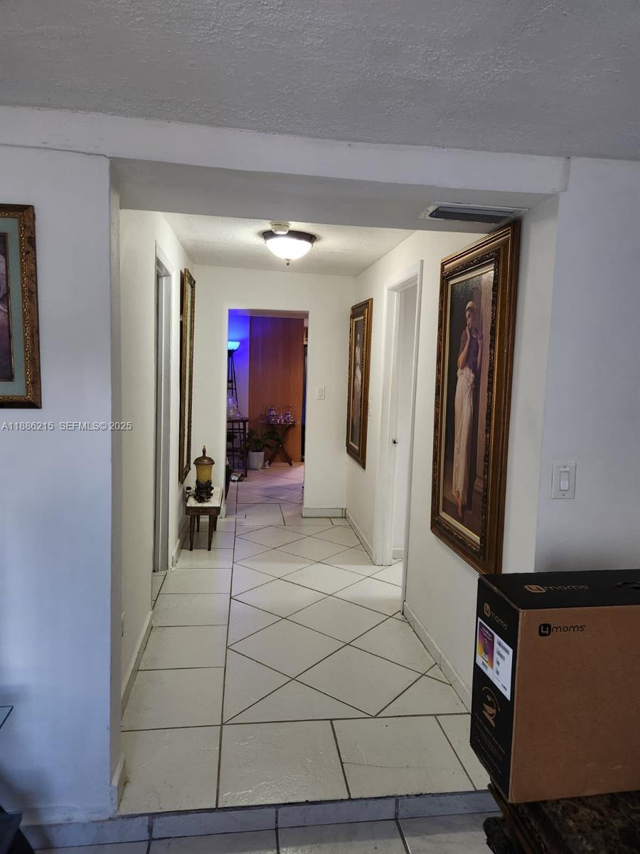 614 East 56th Street Hialeah, FL 33013 - Photo 7 of 78 a view of a hallway with entryway