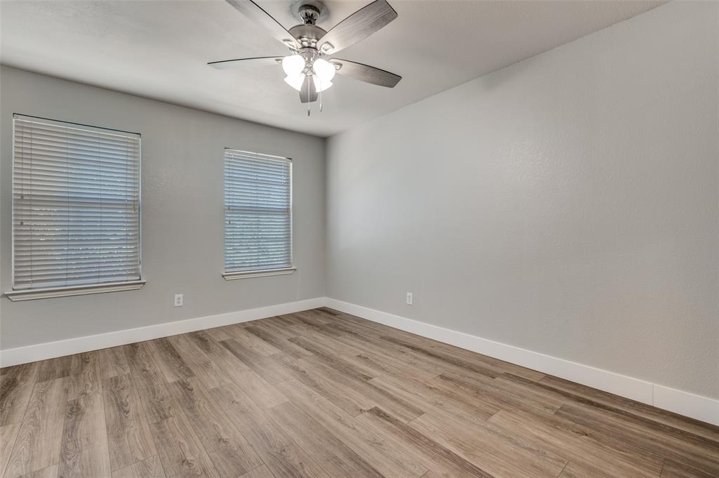 10140 Cedar Lake Drive Providence Village, TX 76227 - Photo 20 of 25 wooden floor in an empty room with a window