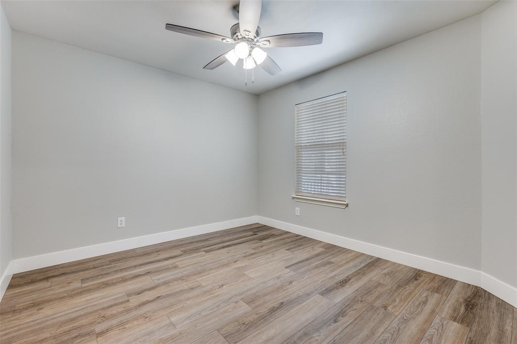 10140 Cedar Lake Drive Providence Village, TX 76227 - Photo 21 of 25 wooden floor in an empty room with a window