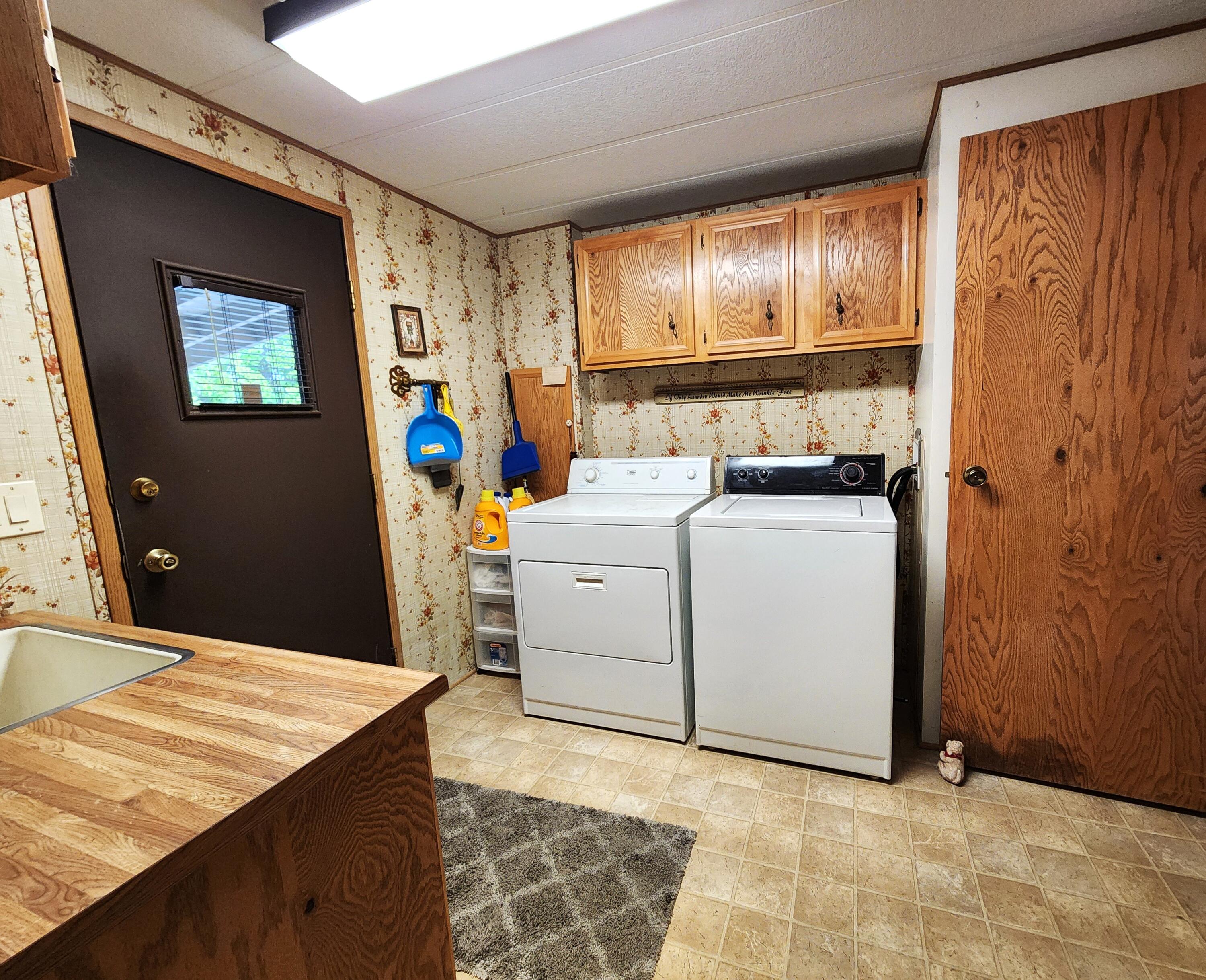 1001 Southeast 15th Street, Unit 34 Bend, OR 97702 - Photo 28 of 43 Laundry room has door to carport