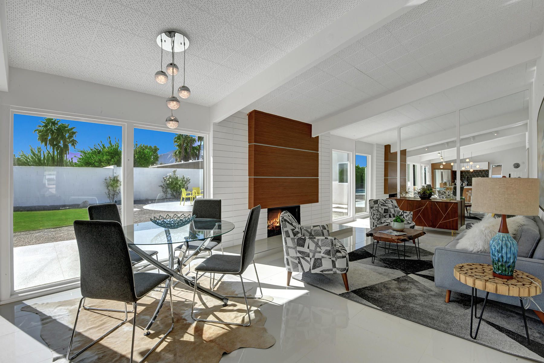 909 East Sunair Road Palm Springs, CA 92262 - Photo 4 of 39 DINING ROOM AND LIVING ROOM TO BACK YARD