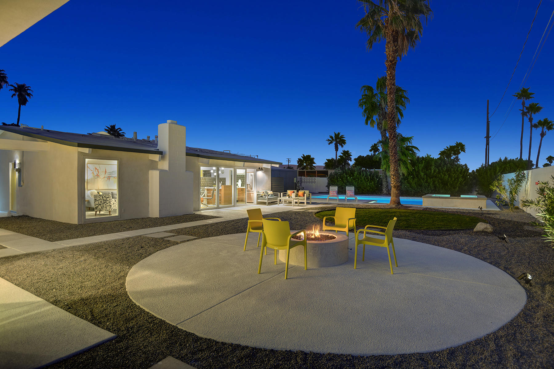 909 East Sunair Road Palm Springs, CA 92262 - Photo 33 of 39 FIRE PIT TO HOUSE AND POOL FROM CASITA N