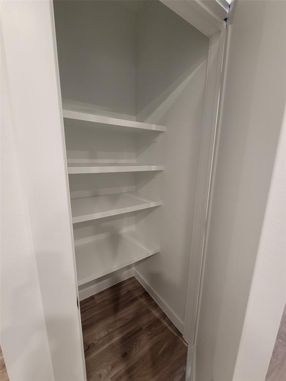 4801 Springdale Road, Unit 2211 Austin, TX 78723 - Photo 9 of 19 Built-in shelving provides convenient storage in this neat pantry.
