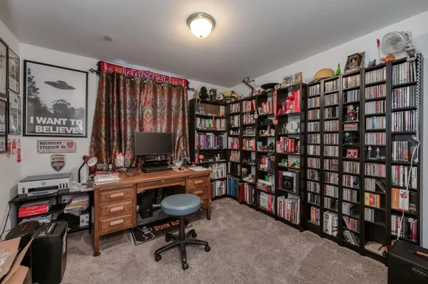 a view of a workspace with furniture