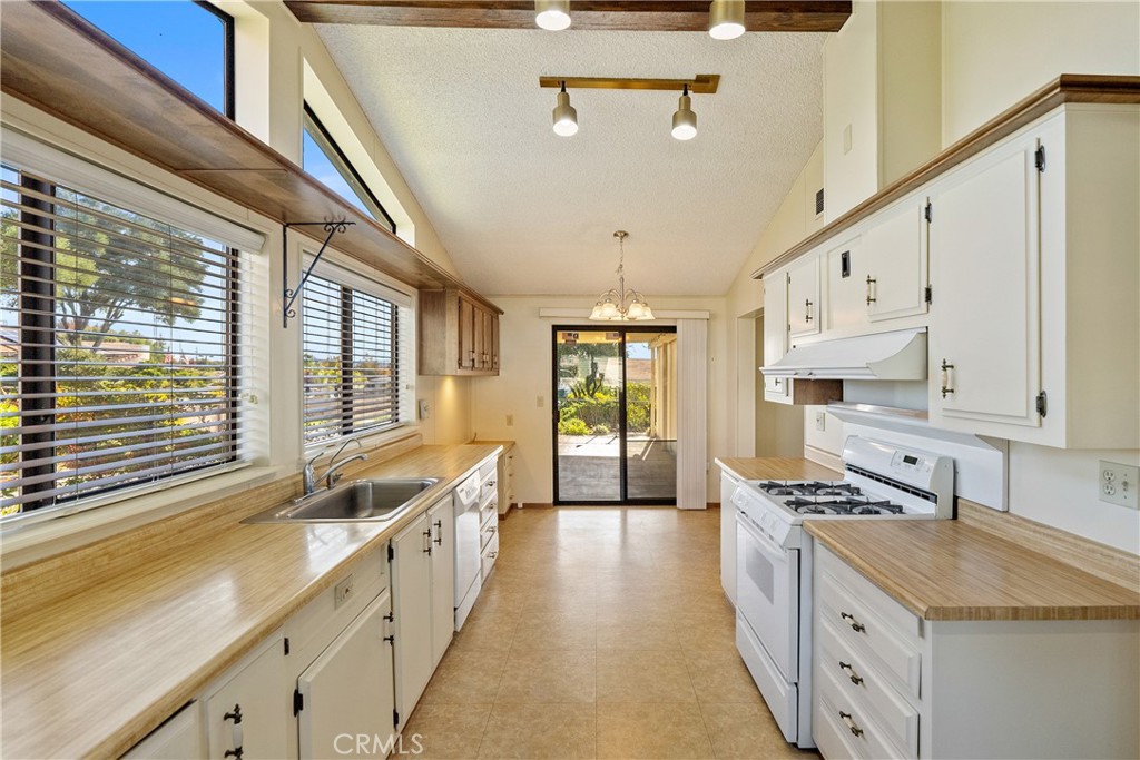 340 Nightingale Avenue Paso Robles, CA 93446 - Photo 15 of 41 a large kitchen with stainless steel appliances granite countertop a lot of counter space and a wooden floors