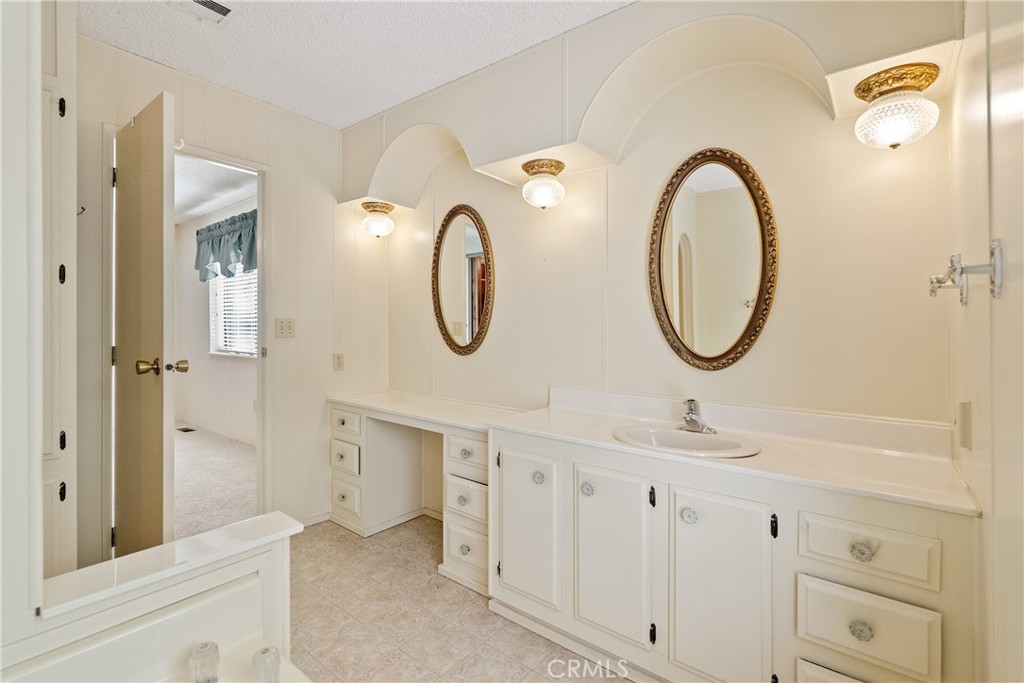 340 Nightingale Avenue Paso Robles, CA 93446 - Photo 30 of 41 a bathroom with a double vanity sink mirror and a mirror