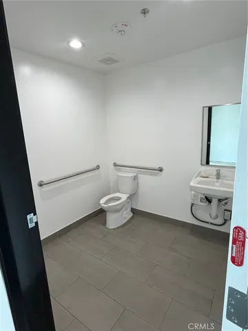 a bathroom with a toilet and a sink