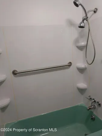 an empty room with wooden floor and closet