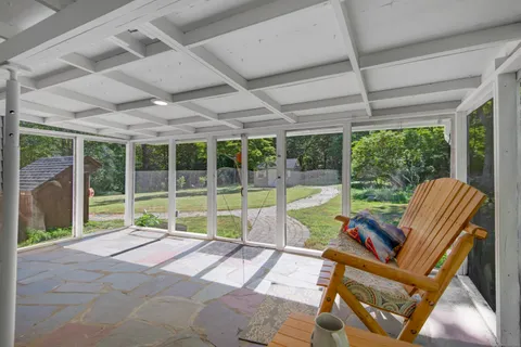 a view of swimming pool with seating area