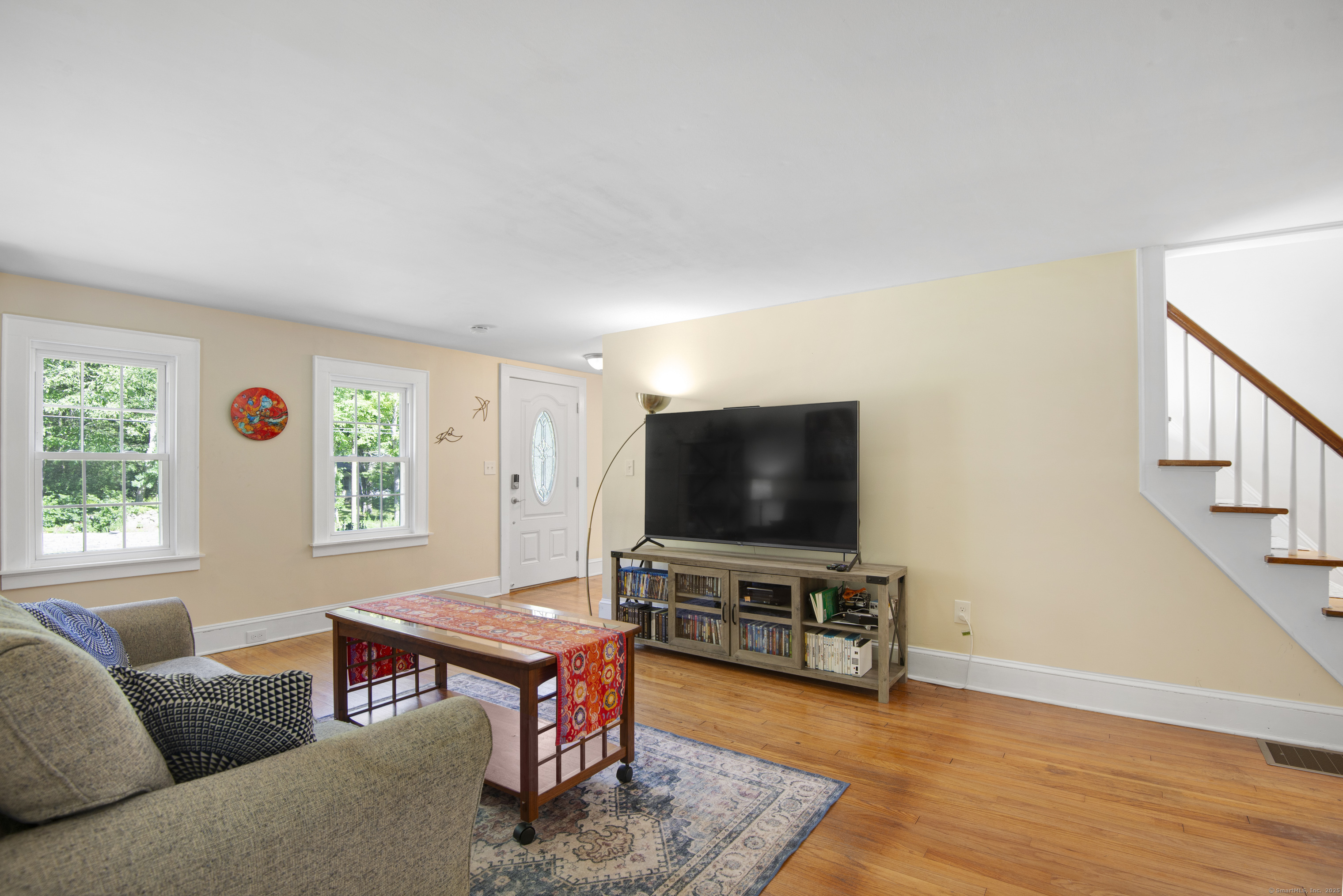 112 Cedar Swamp Road Deep River, CT 06417 - Photo 12 of 37 a living room with furniture and a flat screen tv