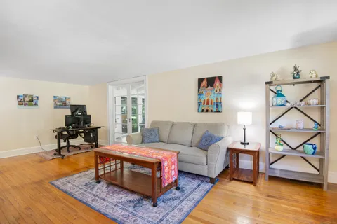 a living room with furniture and a rug