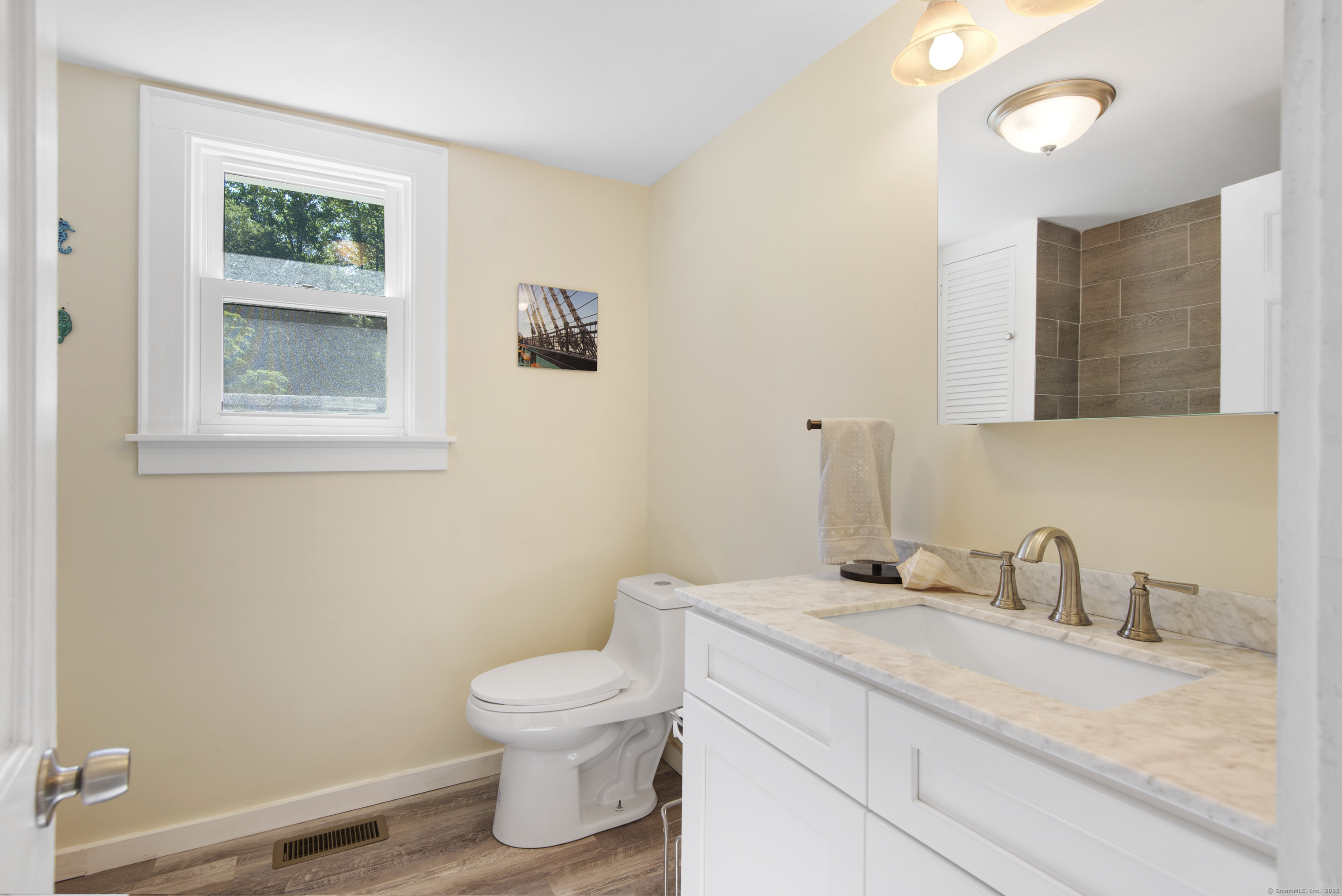 112 Cedar Swamp Road Deep River, CT 06417 - Photo 15 of 37 a bathroom with a granite countertop toilet and a sink