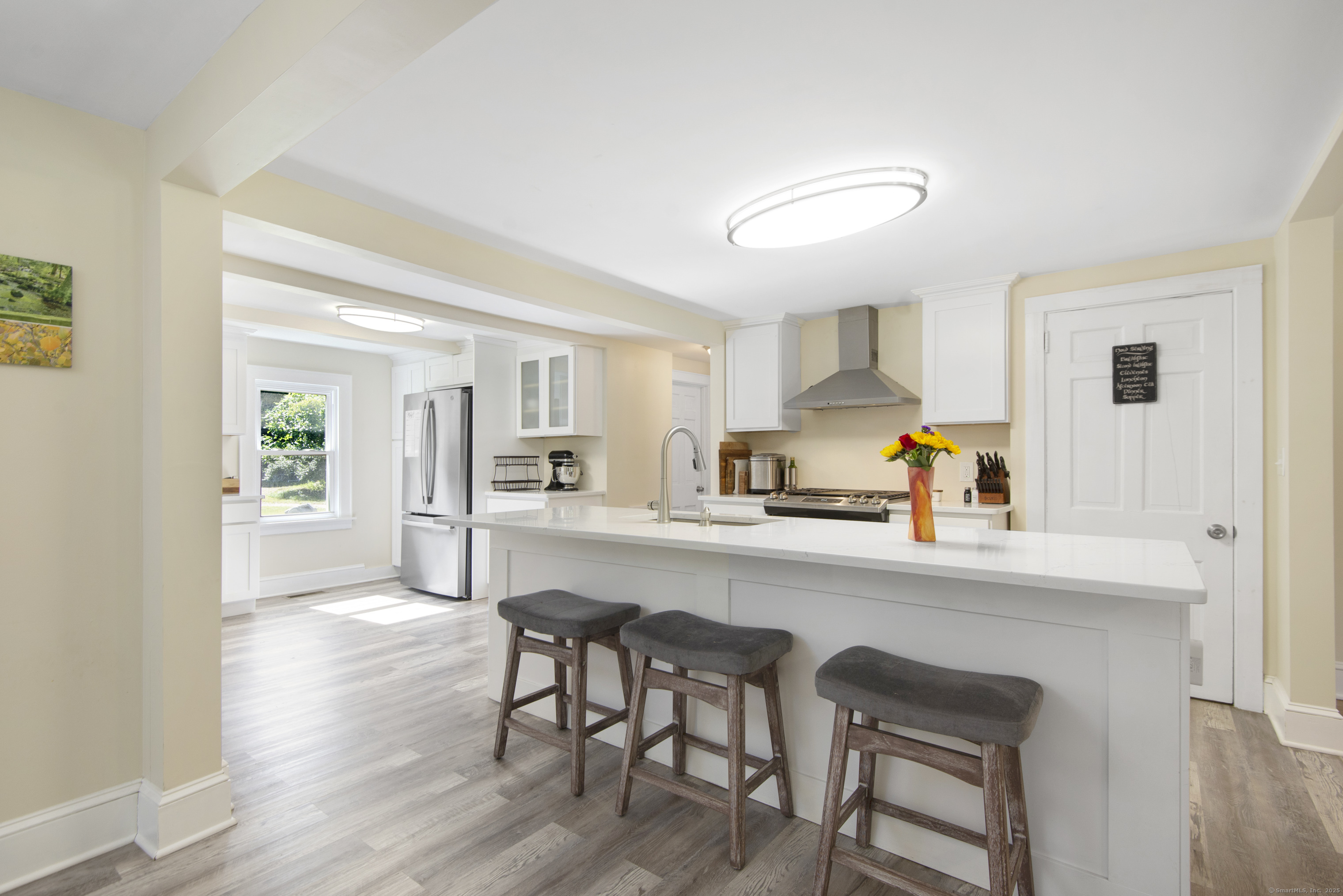 112 Cedar Swamp Road Deep River, CT 06417 - Photo 20 of 37 a kitchen with a table chairs refrigerator and cabinets