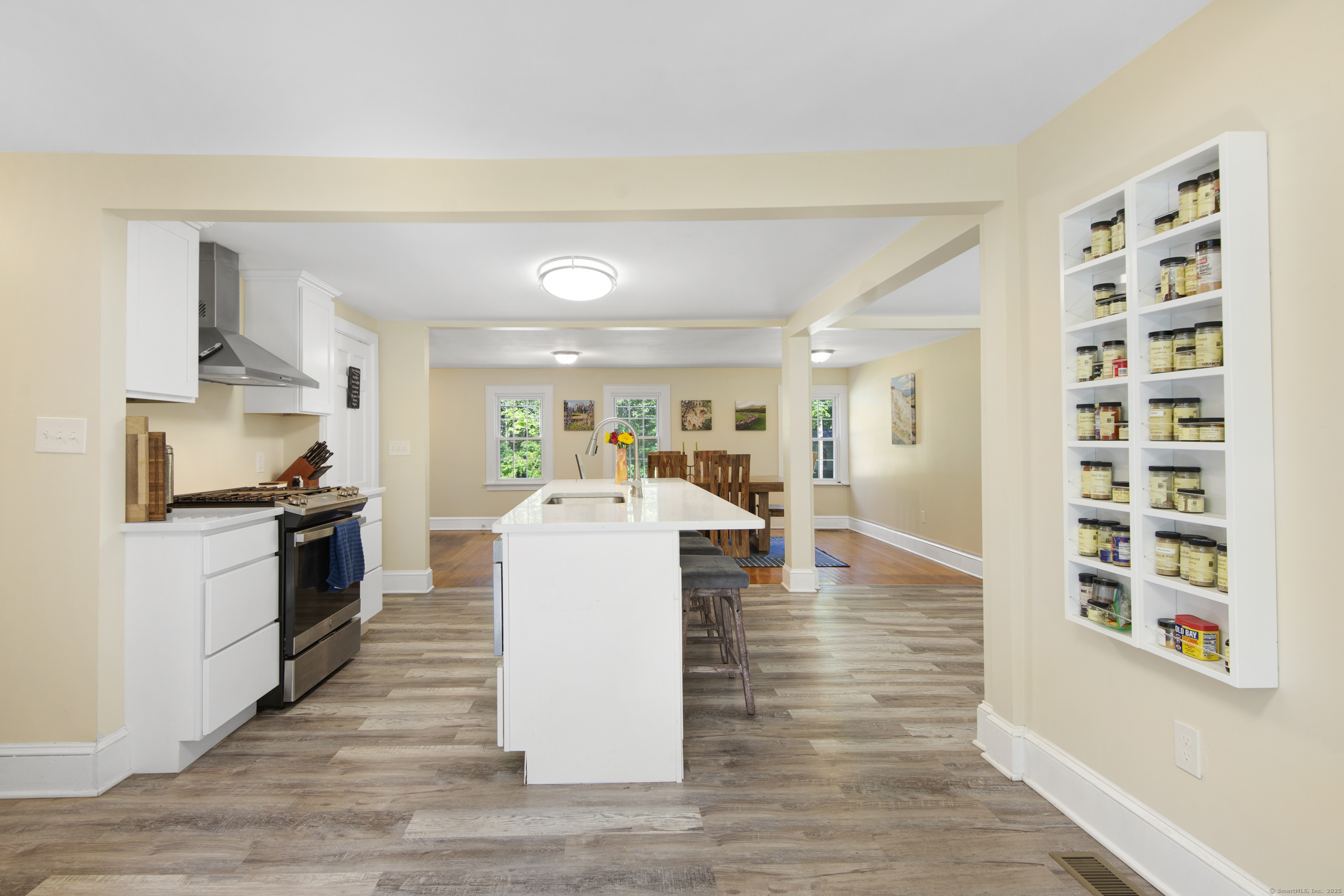 112 Cedar Swamp Road Deep River, CT 06417 - Photo 22 of 37 a living room with furniture and kitchen view with wooden floor