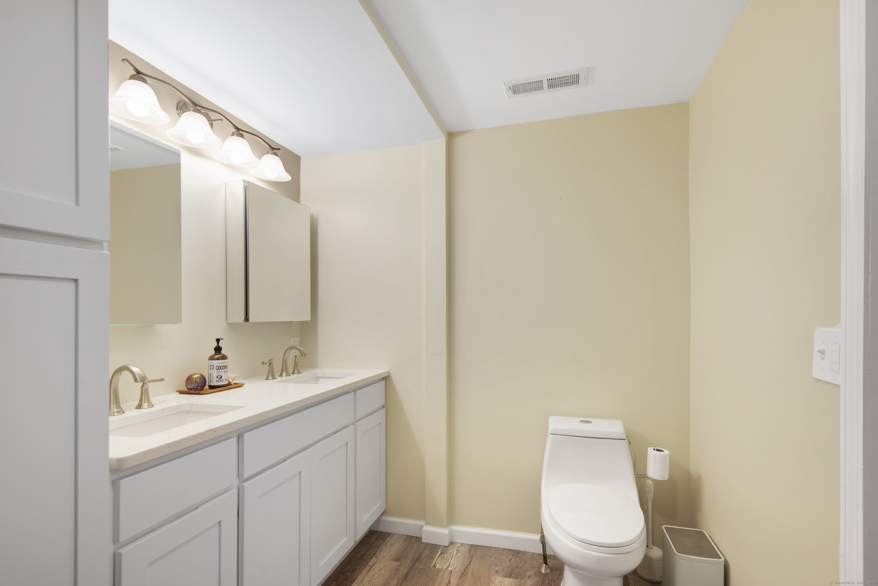 112 Cedar Swamp Road Deep River, CT 06417 - Photo 30 of 37 a bathroom with a toilet a sink and a mirror