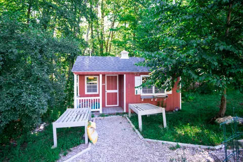 a front view of a house with a garden and porch