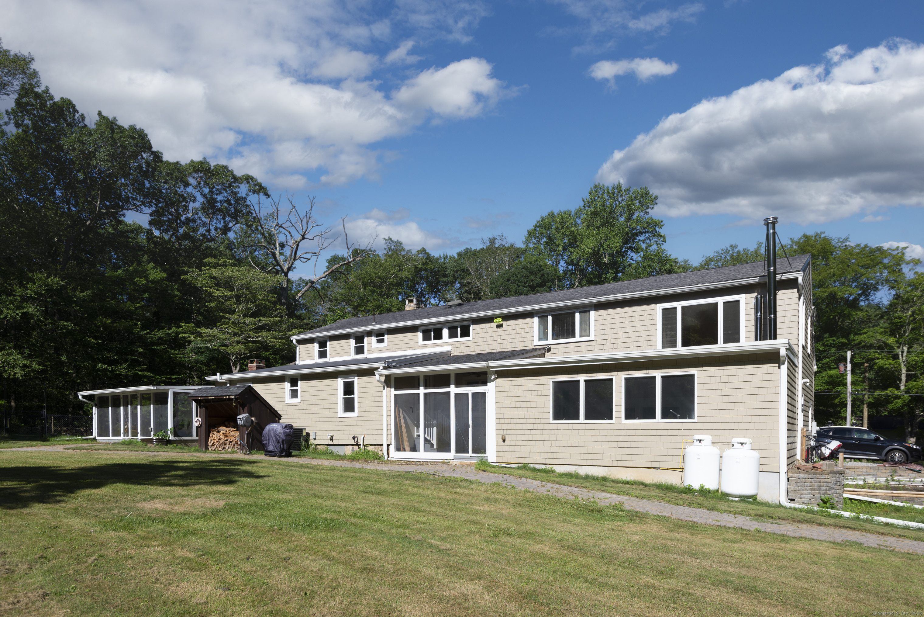 112 Cedar Swamp Road Deep River, CT 06417 - Photo 34 of 37 a front view of a house with a garden