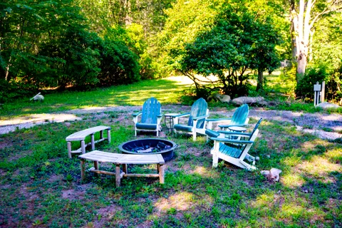 a view of a chair and table in a garden