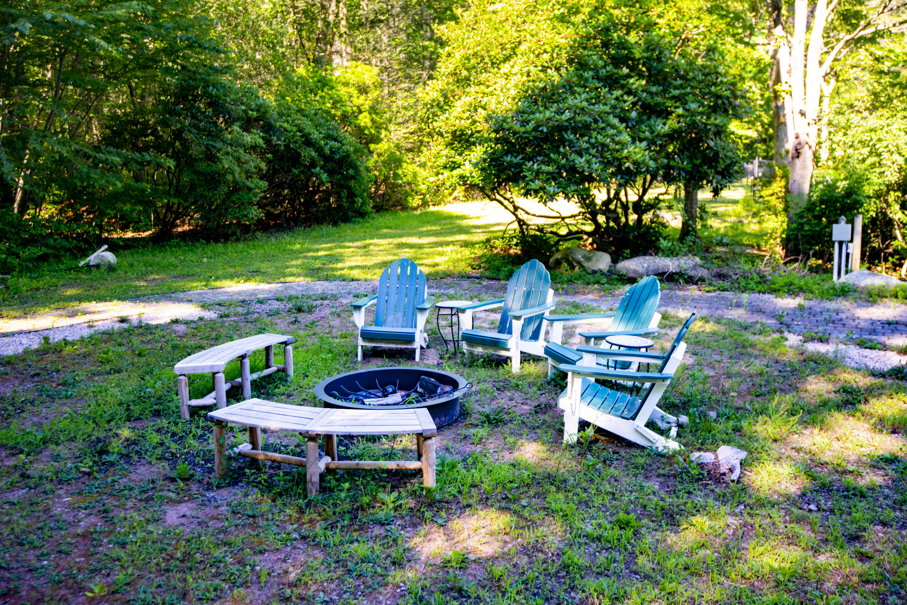 112 Cedar Swamp Road Deep River, CT 06417 - Photo 35 of 37 a view of a chair and table in a garden