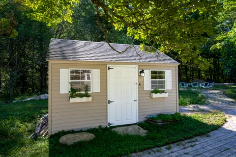 a front view of a house with garden